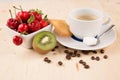 Hot coffee, cake, cherry, strawberry, on the wooden table