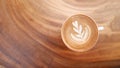 Hot coffee cappuccino latte art top view on wooden background Royalty Free Stock Photo