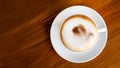 Hot coffee cappuccino latte top view on wooden table background