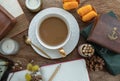 Hot coffee in ceramic cup and brass coffee spoon served with Fresh milk and Sweet egg floss on old wooden worktable