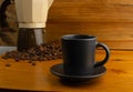 Hot coffee cup and coffee beans on wood background Royalty Free Stock Photo