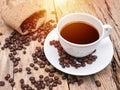 Hot coffee cup with coffee bean on wooden table. coffee background Royalty Free Stock Photo