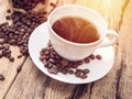 Hot coffee cup with coffee bean on wooden table. coffee bg Royalty Free Stock Photo