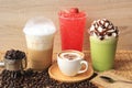 Hot coffee cup with coffee beans on the wooden table, Cold coffee, Iced matcha green tea and fruit soda for summer drink