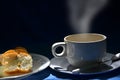 Hot coffee cup and bread dish in the light Royalty Free Stock Photo