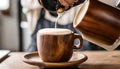 Barista pours milk froth into wood cup, crafting creamy espresso cappuccinoâa blend of textures, flavors, and AI vision