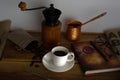 Hot coffee, glasses, fountain pen, book and coffee beans on wooden tray Royalty Free Stock Photo