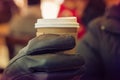 Hot coffee with grab with hand glove