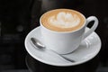 Hot coffee latte, latte art with heart in a white cup Royalty Free Stock Photo