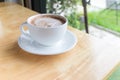 Hot coffee mocha with foam milk during morning time Royalty Free Stock Photo