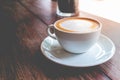 Hot coffee mocha with foam milk in vintage cafe Royalty Free Stock Photo