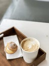 Hot coffee in paper cup and Choux Cream