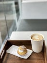 Hot coffee in paper cup and Choux Cream