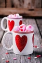 Hot coffee with pink marshmallow in mugs with hearts for Valentine day Royalty Free Stock Photo