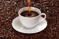 Hot coffee pouring into a cup Royalty Free Stock Photo