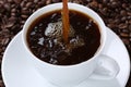 Hot coffee pouring in cup Royalty Free Stock Photo