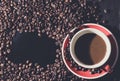 Coffee in red cup and coffee beans are the background. Royalty Free Stock Photo