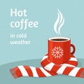 Hot coffee in red cup. Cup of coffee swathed in scarf. Winter