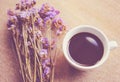 Hot coffee and statice flowers for decorated Royalty Free Stock Photo