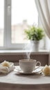 Steaming hot cup of coffee on a table with white roses and a blurred window background Royalty Free Stock Photo
