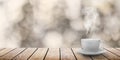 A hot coffee on the table on a spring background Royalty Free Stock Photo