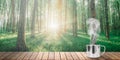 A hot coffee on the table on a spring forest background Royalty Free Stock Photo