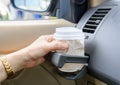 Hot coffee to go at cup holder in a car. Royalty Free Stock Photo