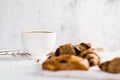 Hot coffee white cup ,with bakery placed on white wood table,With sunshine in morning, beauty concept of beverage,food with Royalty Free Stock Photo