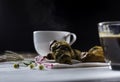 Hot coffee white cup ,with bakery placed on white wood table,With sunshine in morning, beauty concept of beverage,food with Royalty Free Stock Photo