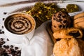 Hot coffee in white cup, with bakery, placed on white wood table, With sunshine in morning,Beauty concept of beverage and food Royalty Free Stock Photo