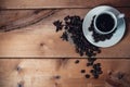Hot coffee in a white coffee cup and lots of coffee beans on a wooden table, with space to copy. Selective focus. Royalty Free Stock Photo