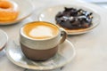 Hot cofffee, cappuccino coffee or latte coffee and donut