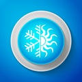 Hot and cold symbol. Sun and snowflake icon isolated on blue background. Winter and summer symbol. Circle blue button