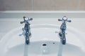 Hot and cold taps in bathroom Royalty Free Stock Photo