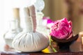 Hot Compress Massage. Spa compress ball and lotus flower Royalty Free Stock Photo