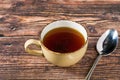 Hot consomme beef tail served in ceramic cup on rustic wooden table Royalty Free Stock Photo