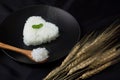 Hot cook jasmine rice on spoon serve with smoke.rice heart shape Royalty Free Stock Photo