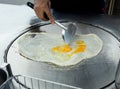 Top view of Fried delicious Roti topping with egg, focus selective Royalty Free Stock Photo