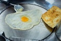 Top view of Fried delicious Roti topping with egg, focus selective Royalty Free Stock Photo