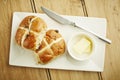 Hot cross bun on white dish Royalty Free Stock Photo