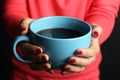 Hot cup of coffee in the women's hands Royalty Free Stock Photo