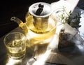 Hot cup of a green tea and kettle Royalty Free Stock Photo