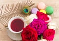 Hot cup of red tea and colored cakes Royalty Free Stock Photo