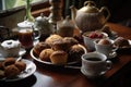 hot cup of tea and assortment of muffins, scones, and other pastries Royalty Free Stock Photo