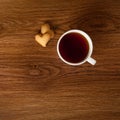 Hot cup of tea with cookies on wooden table Royalty Free Stock Photo
