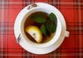 Hot cup of tea whith lemon and mint