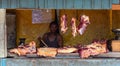 A hot day in Miandrivazo, Madagascar, with a street stall butcher shop open