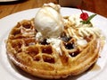 Hot delicious homemade Belgium waffles and maple syrup ice cream and cream