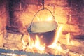 Hot delicious steaming food in a cast iron pot