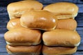 Hot dog bun is a type of soft bun shaped specifically to contain a hot dog or another type of sausage, small side-loading buns for